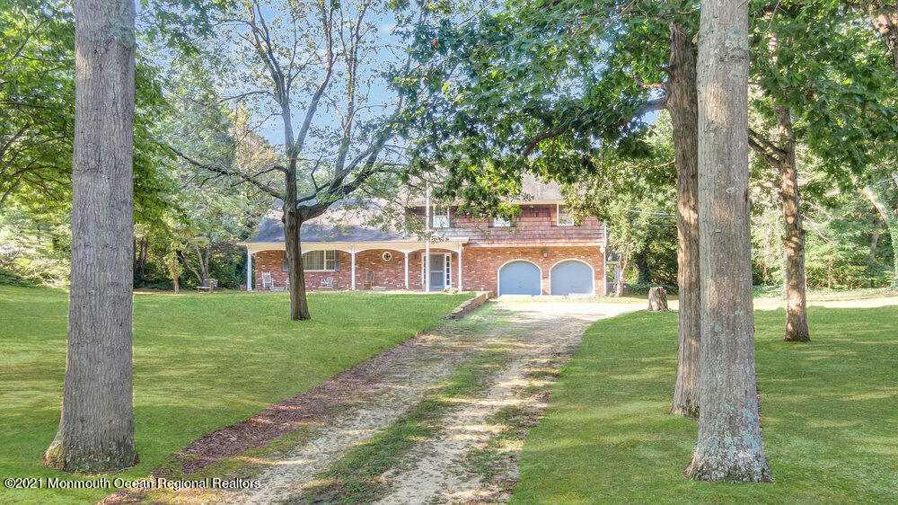 3234 Ridgewood Road Allenwood, NJ 08720 - Photo 2 of 49 a front view of a house with a yard