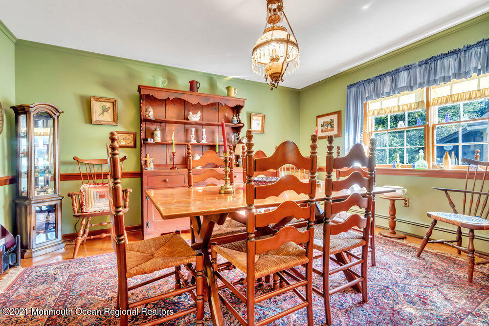 3234 Ridgewood Road Allenwood, NJ 08720 - Photo 14 of 49 a view of a dining room with furniture and chandelier