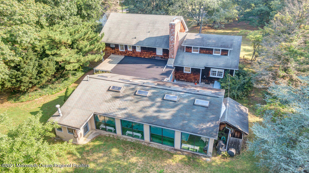 3234 Ridgewood Road Allenwood, NJ 08720 - Photo 3 of 49 an aerial view of a house with a yard table and chairs