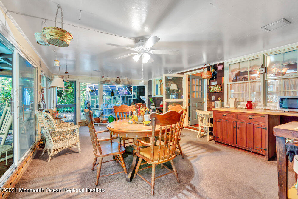 3234 Ridgewood Road Allenwood, NJ 08720 - Photo 23 of 49 a view of a dining room and hall with furniture