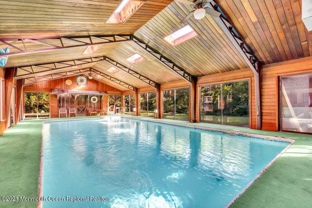 3234 Ridgewood Road Allenwood, NJ 08720 - Photo 24 of 49 a view of a swimming pool with a outdoor seating