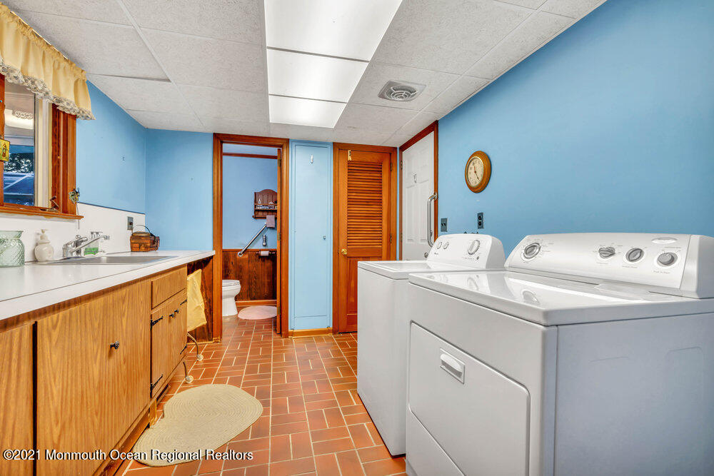 3234 Ridgewood Road Allenwood, NJ 08720 - Photo 28 of 49 a bathroom with a sink a mirror and a shower