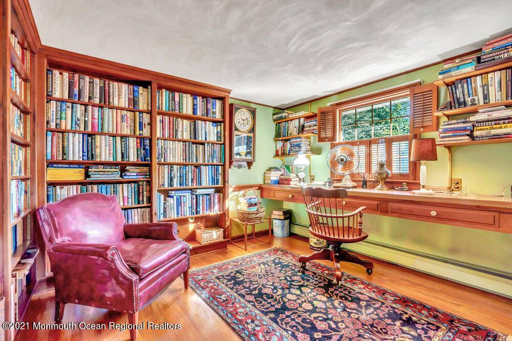 3234 Ridgewood Road Allenwood, NJ 08720 - Photo 31 of 49 a living room with furniture and a book shelf