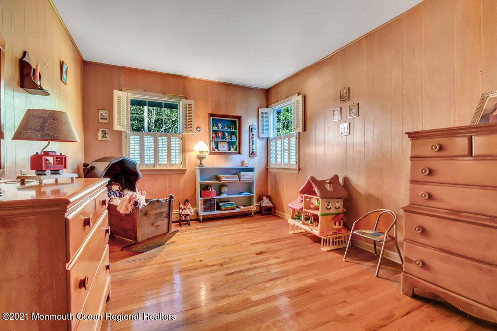 3234 Ridgewood Road Allenwood, NJ 08720 - Photo 37 of 49 a room with furniture a flat screen tv and a window