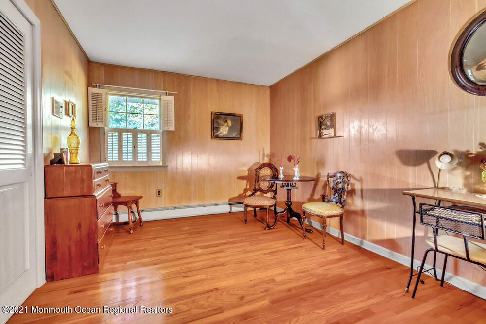 3234 Ridgewood Road Allenwood, NJ 08720 - Photo 38 of 49 a living room with furniture a window and wooden floor
