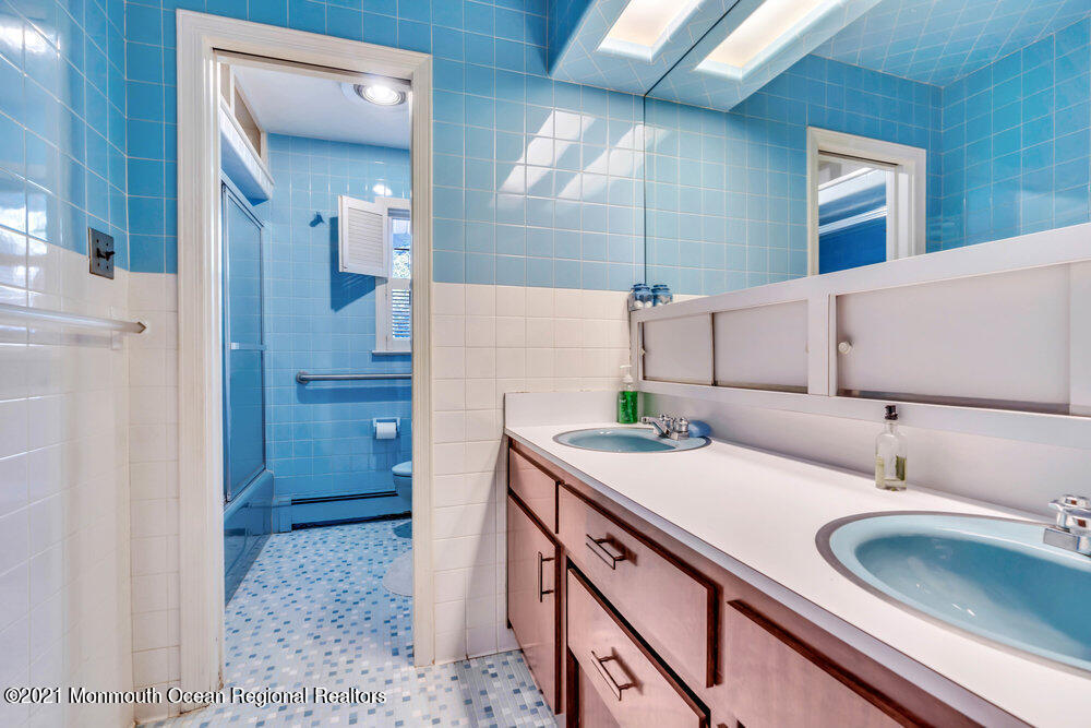 3234 Ridgewood Road Allenwood, NJ 08720 - Photo 40 of 49 a bathroom with a sink and a mirror