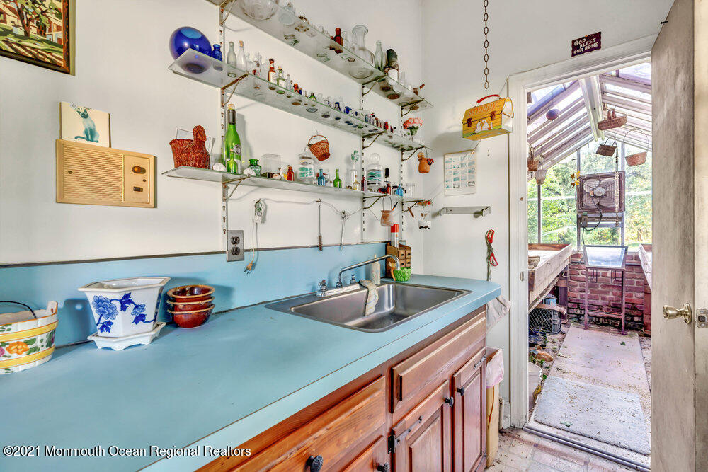 3234 Ridgewood Road Allenwood, NJ 08720 - Photo 41 of 49 a kitchen with a refrigerator and a sink
