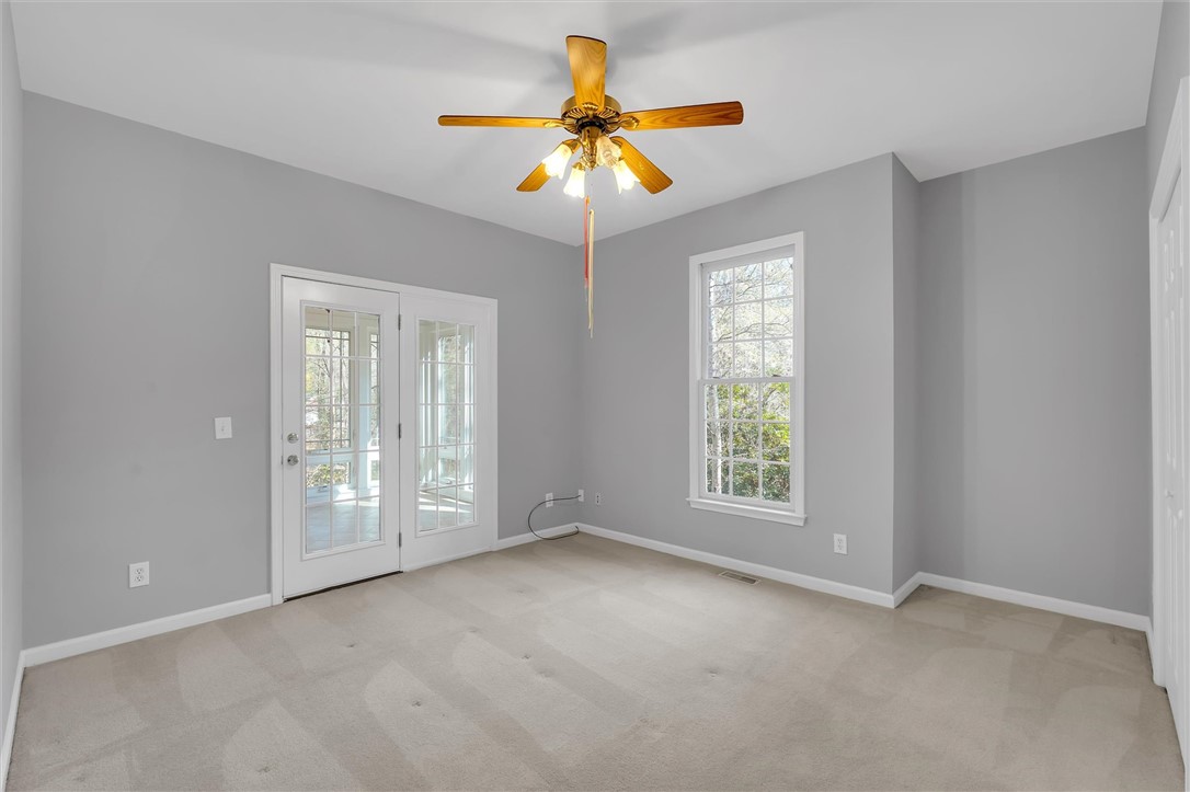 204 Red Maple Way Clemson, SC 29631 - Photo 20 of 48 This spacious bedroom offers abundant natural light and private outdoor access.