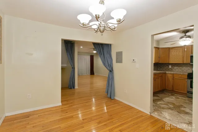 a view of a hallway with a chandelier