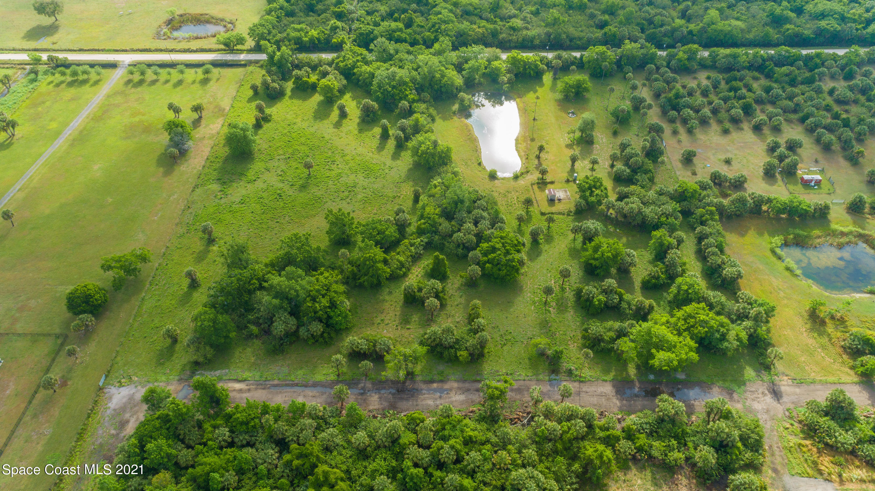 1560 County Line Road Oak Hill, FL 32759 - Photo 18 of 22 Aerial from West