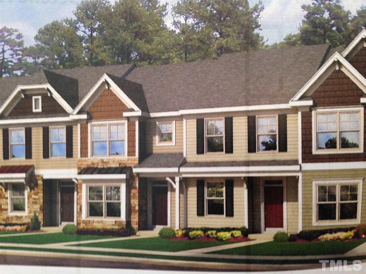 6331 Pesta Court Raleigh, NC 27612 - Photo 1 of 3 a view of a big house with large windows and a yard in front of it