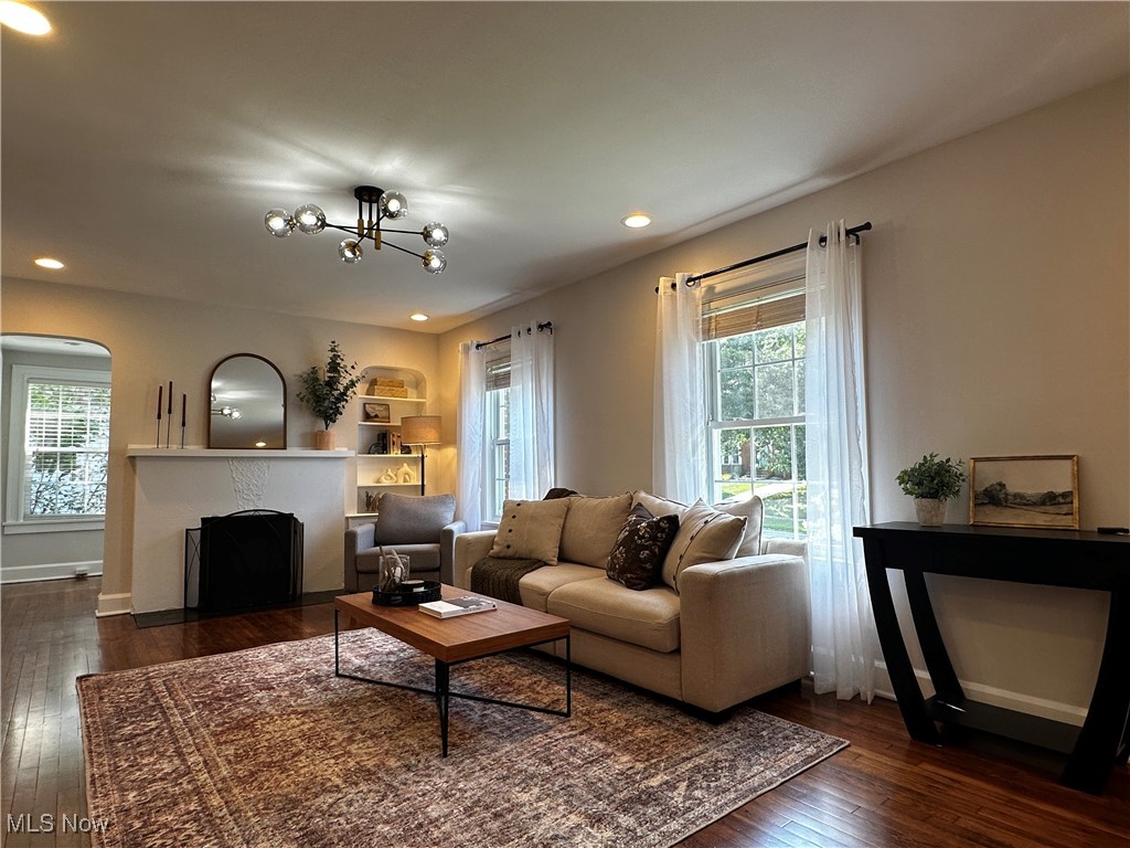 2255 Edgerton Road University Heights, OH 44118 - Photo 9 of 33 Living room featuring dark wood-type flooring and a notable chandelier