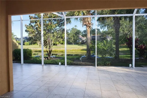 a view of a house with backyard and porch