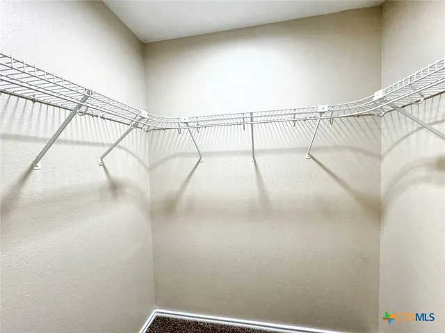 a view of a room with racks on the wall