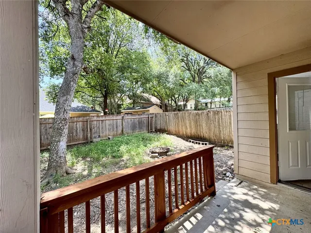 a view of outdoor space with deck and yard