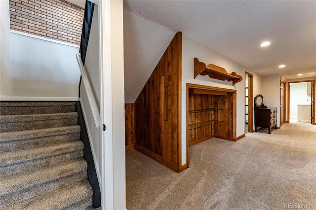 a view of a hallway with staircase
