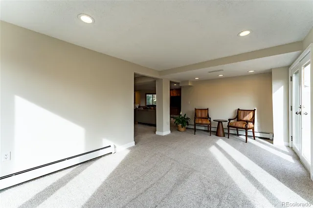 a view of a livingroom with furniture and a window