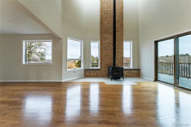 a view of an entryway with wooden floor and windows