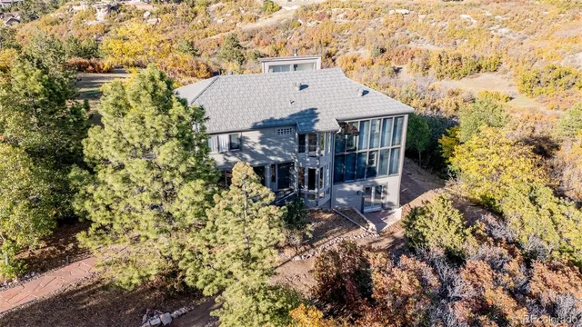 a view of living room with furniture and wooden floor