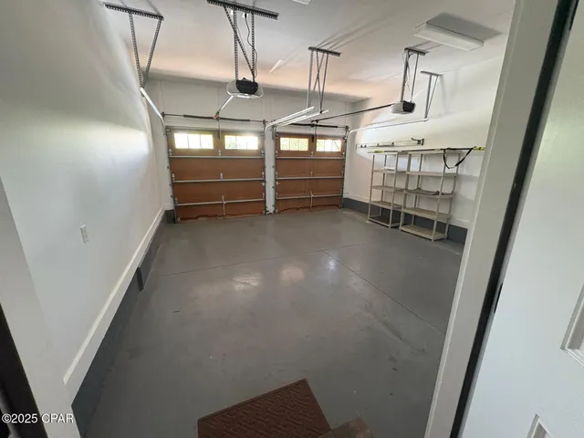 a view of empty room with stairs