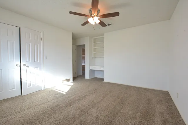 a bathroom with a granite countertop sink mirror and a bathtub