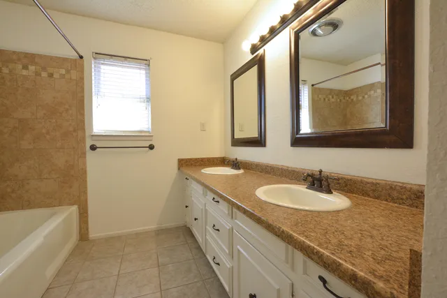 a view of a porch with a floor to ceiling window and wooden fence