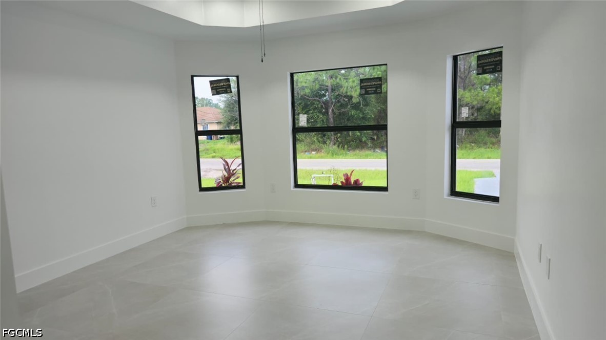 4429 26th Street Southwest Lehigh Acres, FL 33973 - Photo 16 of 16 an empty room with windows