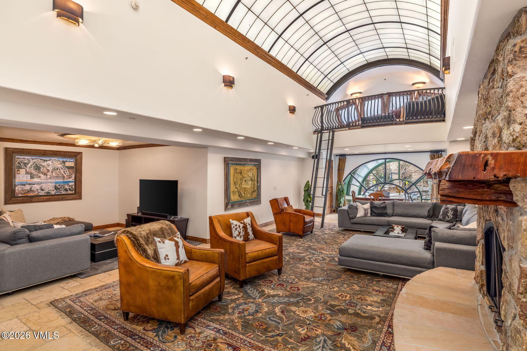 12 Vail Road, Unit R8 Vail, CO 81657 - Photo 11 of 41 a living room with furniture and a fireplace