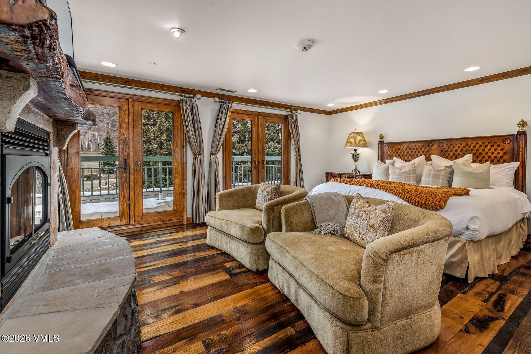 12 Vail Road, Unit R8 Vail, CO 81657 - Photo 23 of 41 a living room with furniture ceiling fan and a rug