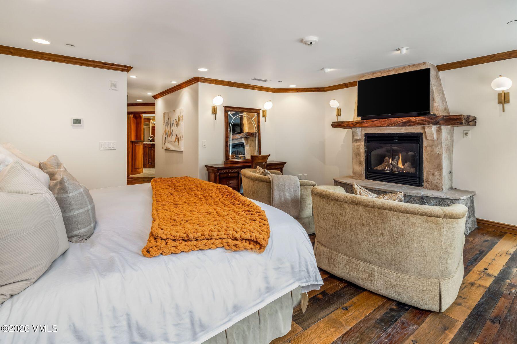12 Vail Road, Unit R8 Vail, CO 81657 - Photo 26 of 41 a living room with furniture and a fireplace