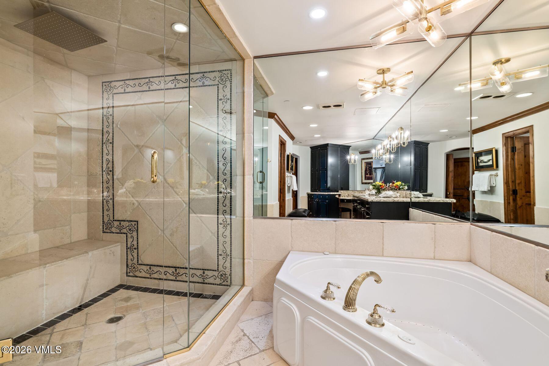 12 Vail Road, Unit R8 Vail, CO 81657 - Photo 29 of 41 a bathroom with a bathtub and a shower