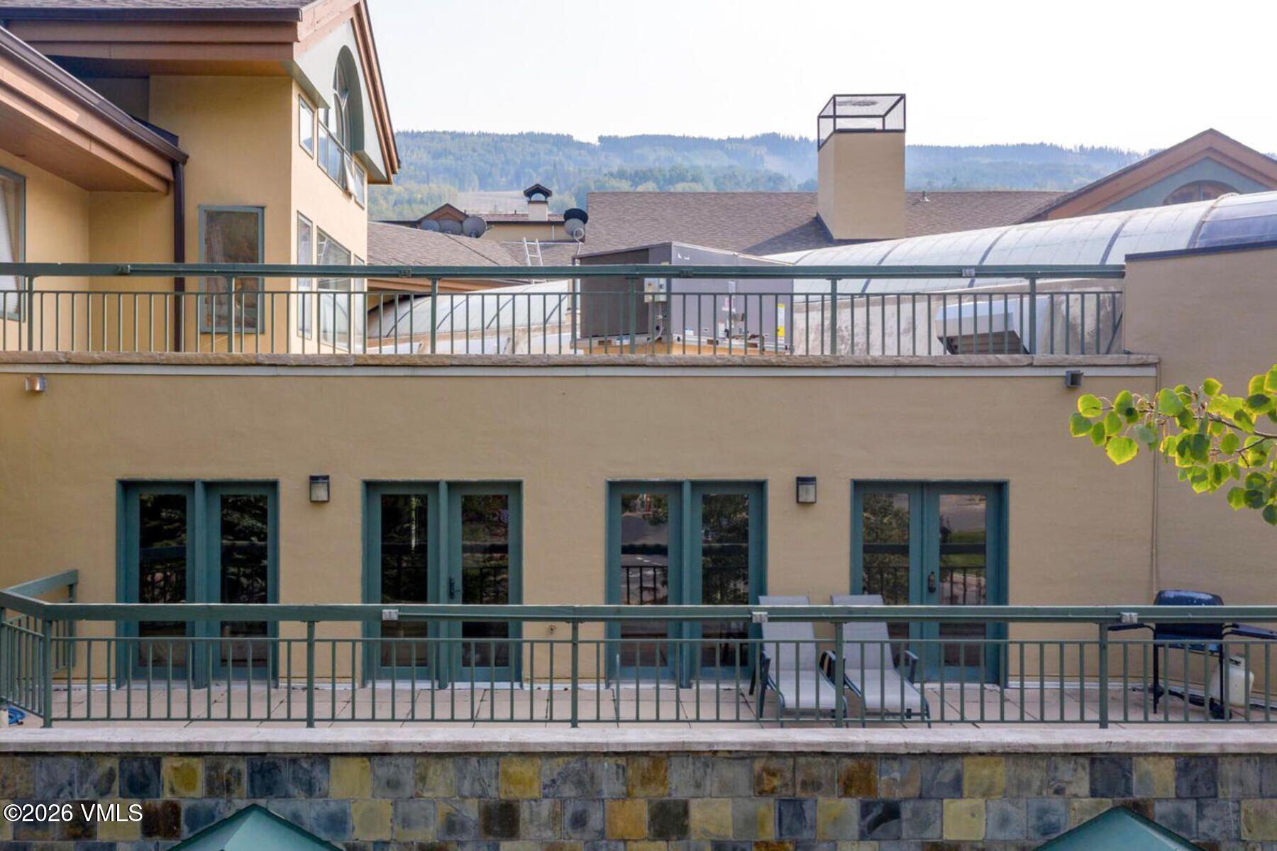 12 Vail Road, Unit R8 Vail, CO 81657 - Photo 30 of 41 a front view of a house with glass windows