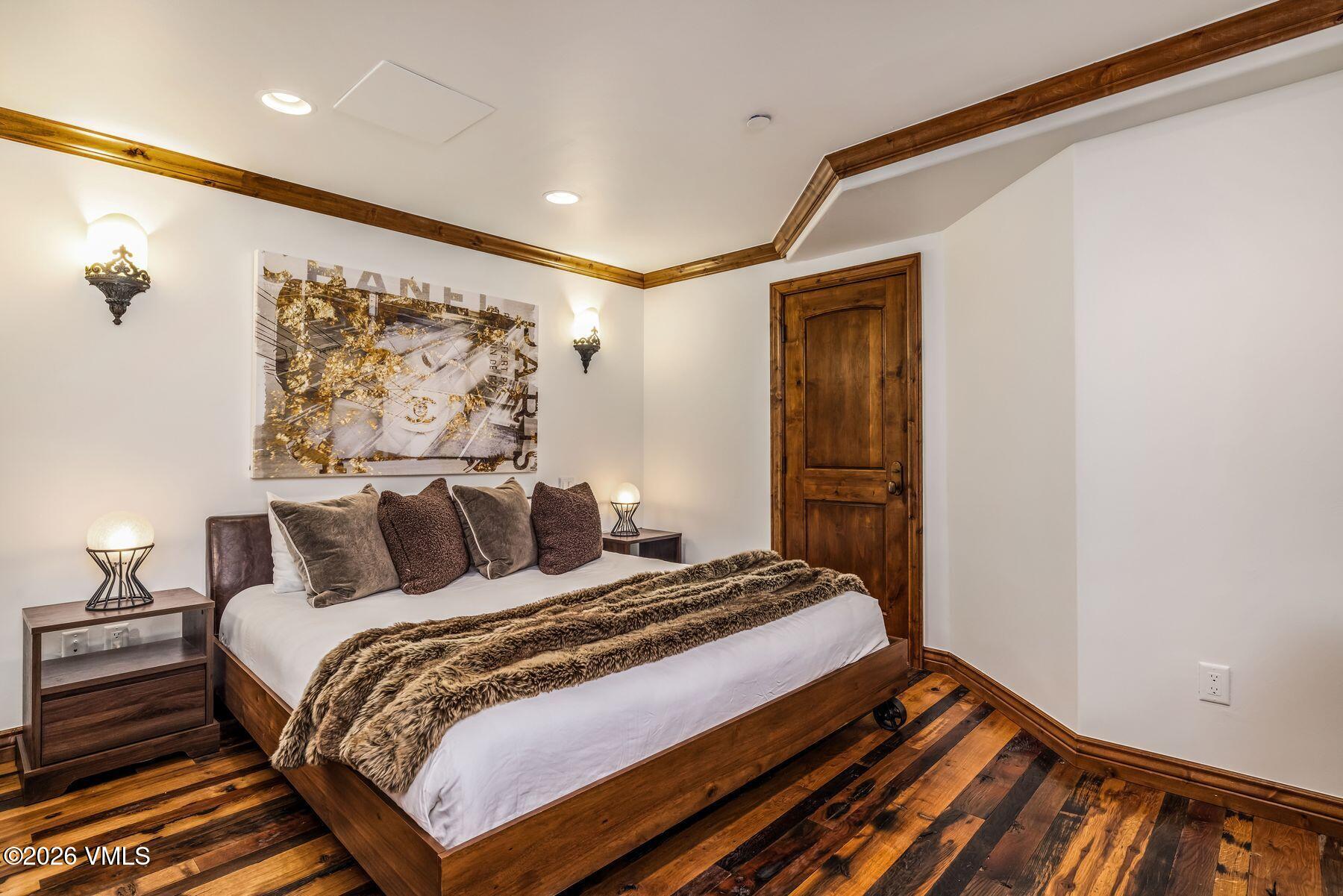 12 Vail Road, Unit R8 Vail, CO 81657 - Photo 36 of 41 a bedroom with a bed and a walk in closet