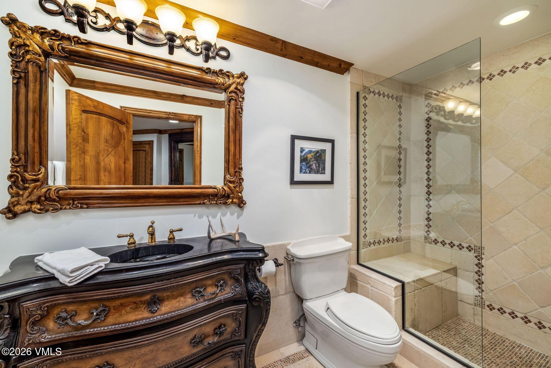 12 Vail Road, Unit R8 Vail, CO 81657 - Photo 38 of 41 a bathroom with a toilet a sink and shower