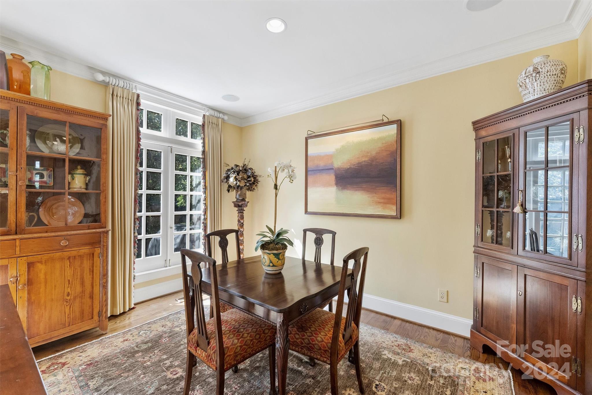 1905 Queens Road Charlotte, NC 28207 - Photo 11 of 44 a dining room with furniture a livingroom view and wooden floor