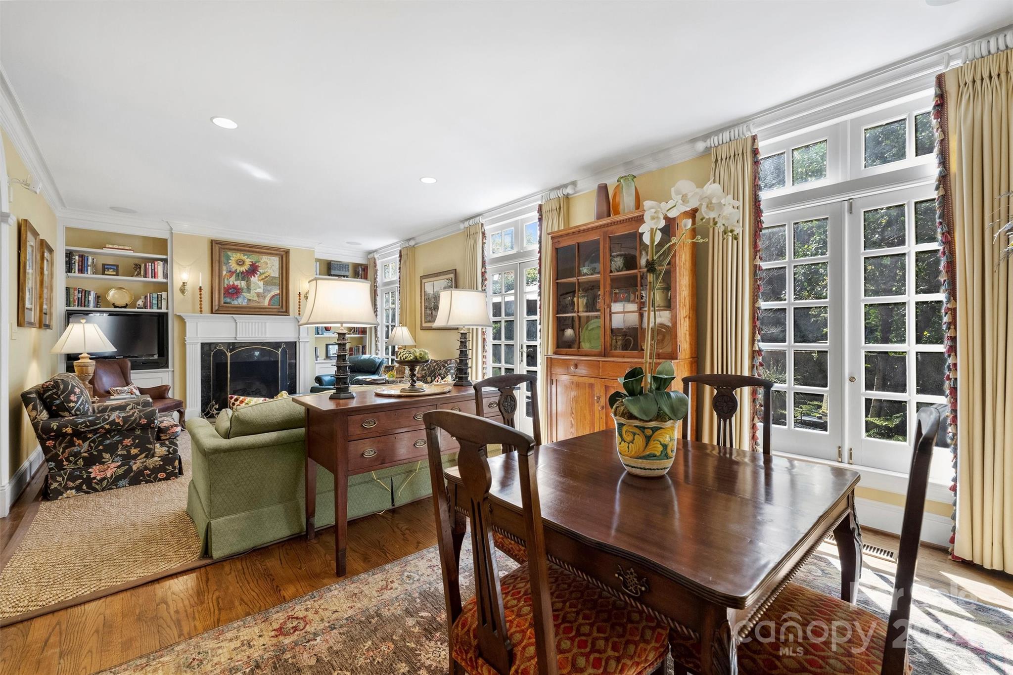 1905 Queens Road Charlotte, NC 28207 - Photo 12 of 44 a living room with fireplace furniture and a wooden floor