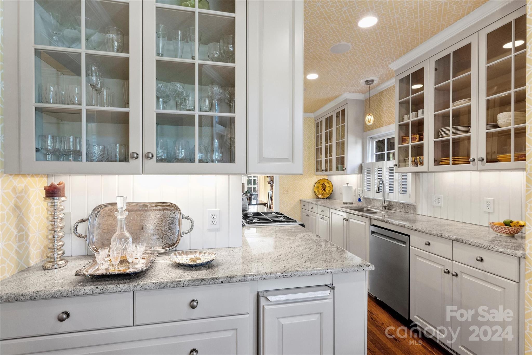 1905 Queens Road Charlotte, NC 28207 - Photo 15 of 44 a kitchen with granite countertop stainless steel appliances window and cabinets