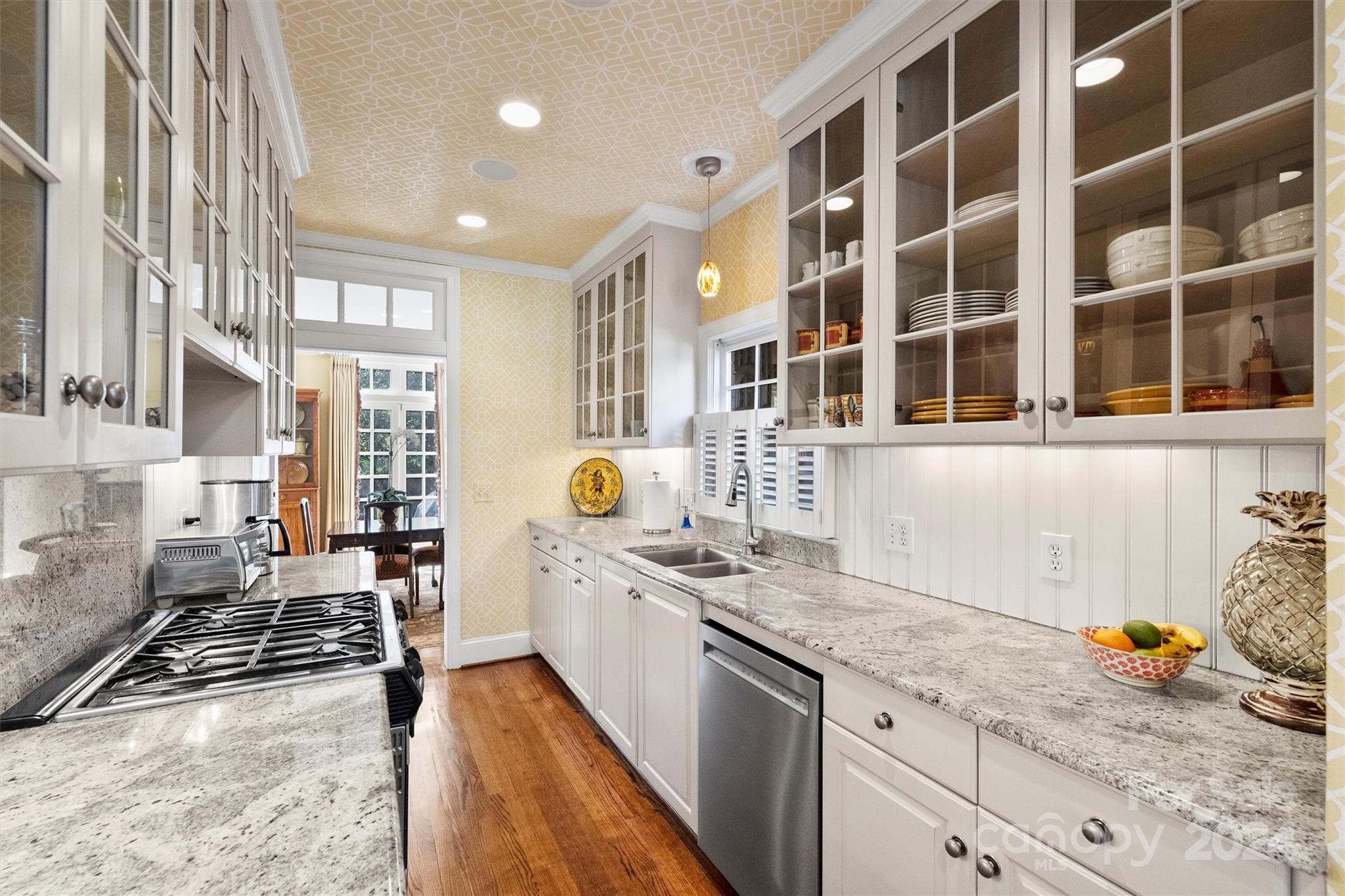 1905 Queens Road Charlotte, NC 28207 - Photo 16 of 44 a kitchen with stainless steel appliances granite countertop a stove and a sink