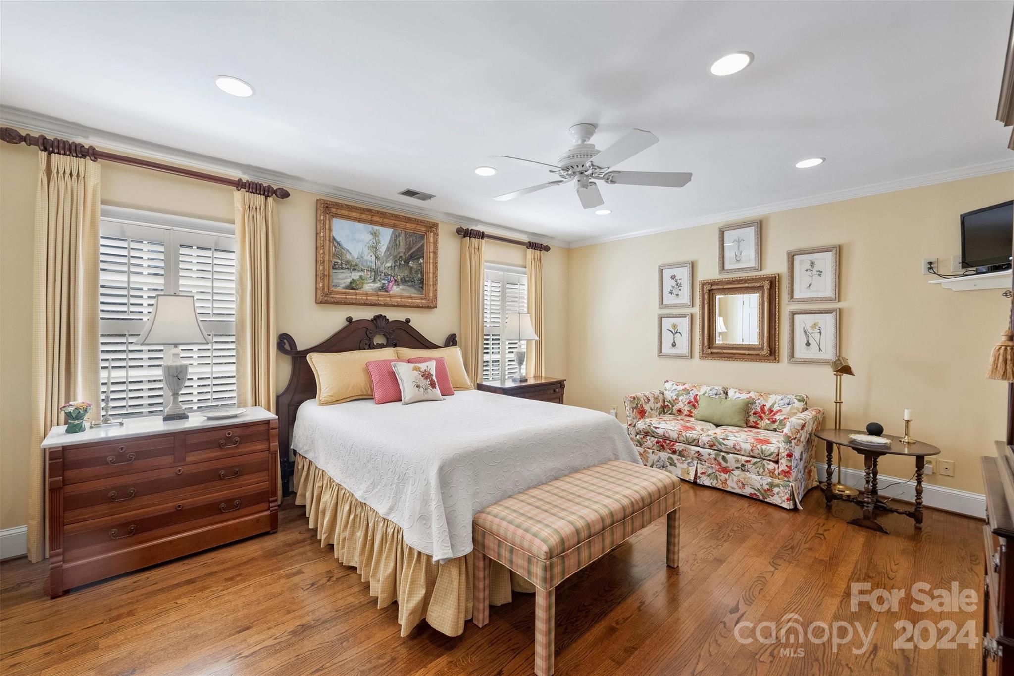 1905 Queens Road Charlotte, NC 28207 - Photo 23 of 44 a bedroom with a bed and wooden floor