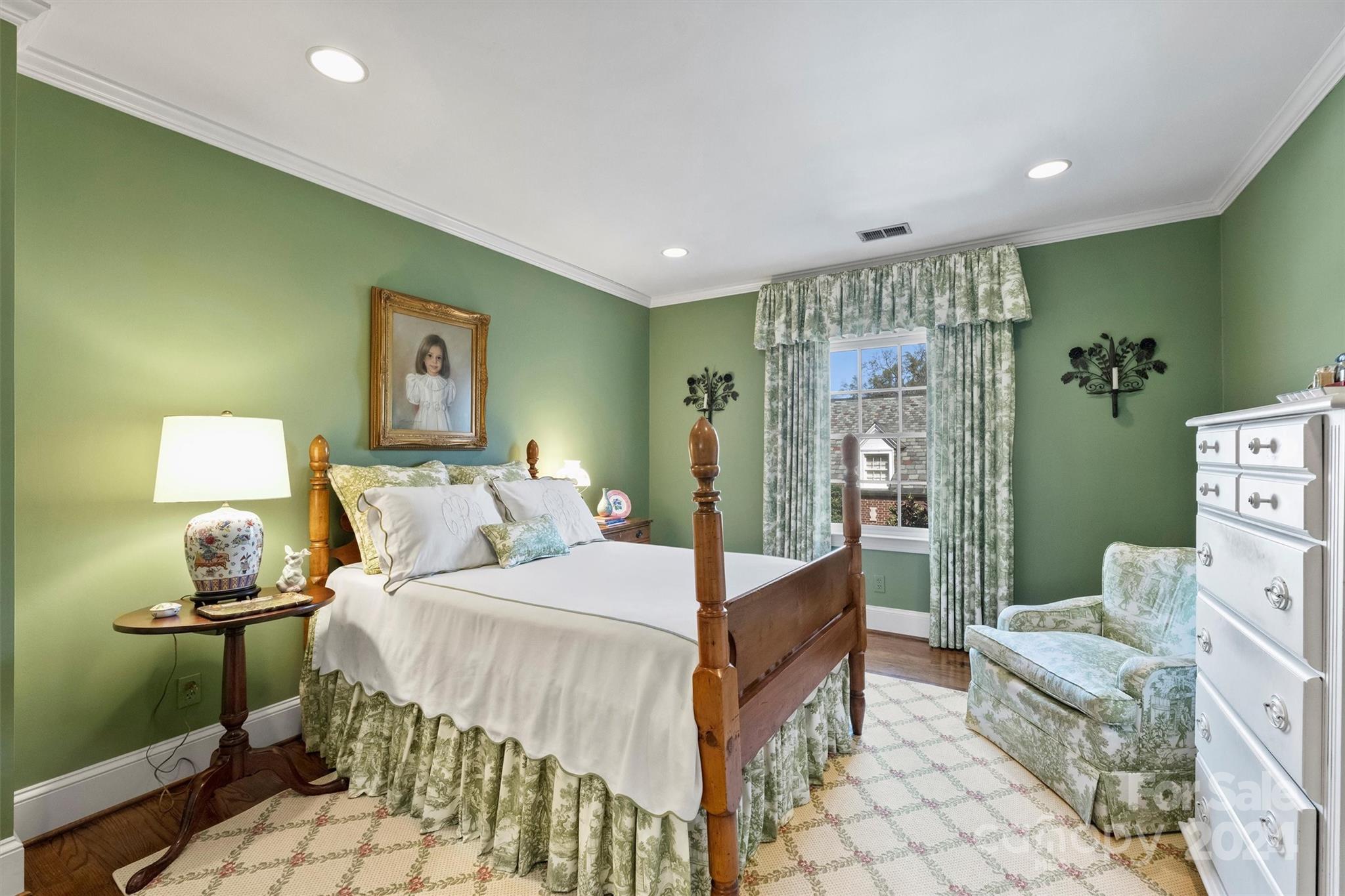 1905 Queens Road Charlotte, NC 28207 - Photo 27 of 44 a bedroom with a bed and a table in it