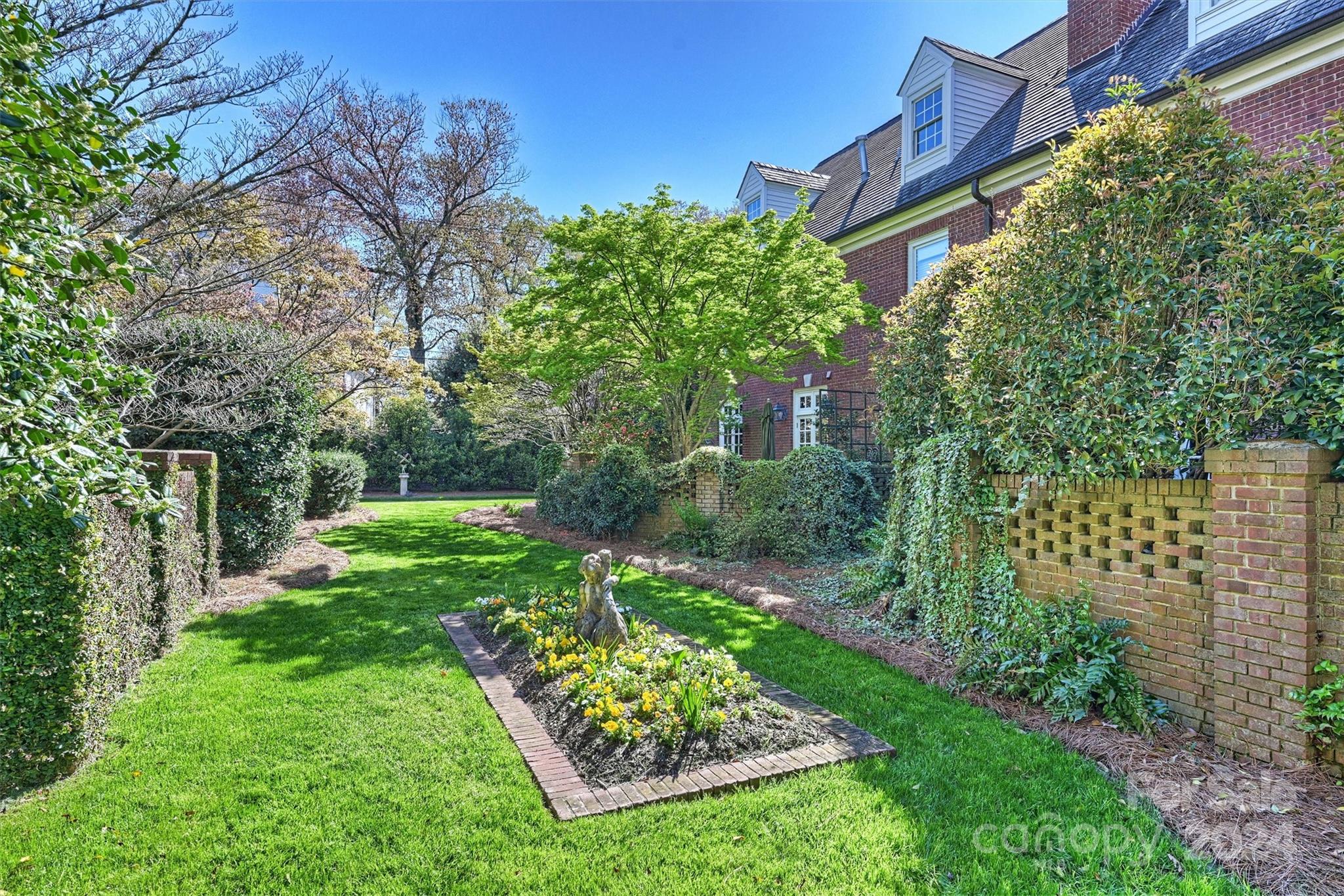 1905 Queens Road Charlotte, NC 28207 - Photo 36 of 44 a view of a garden with large trees