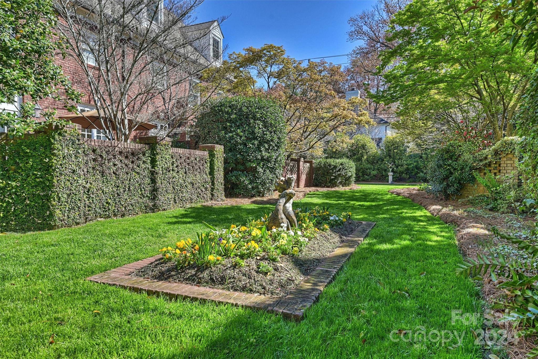 1905 Queens Road Charlotte, NC 28207 - Photo 38 of 44 a view of a garden with a fountain