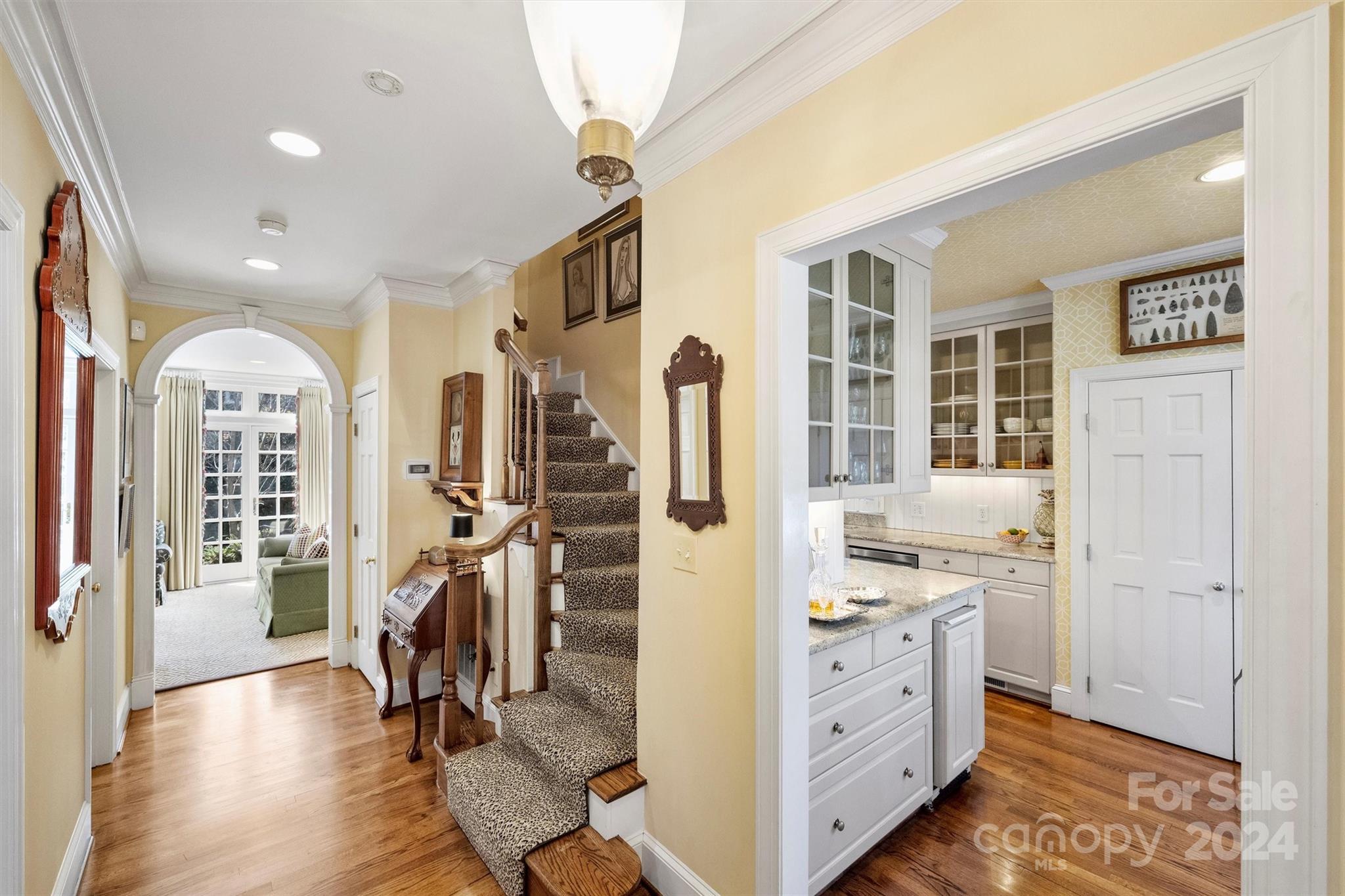 1905 Queens Road Charlotte, NC 28207 - Photo 4 of 44 a view of a kitchen with fridge and wooden floor
