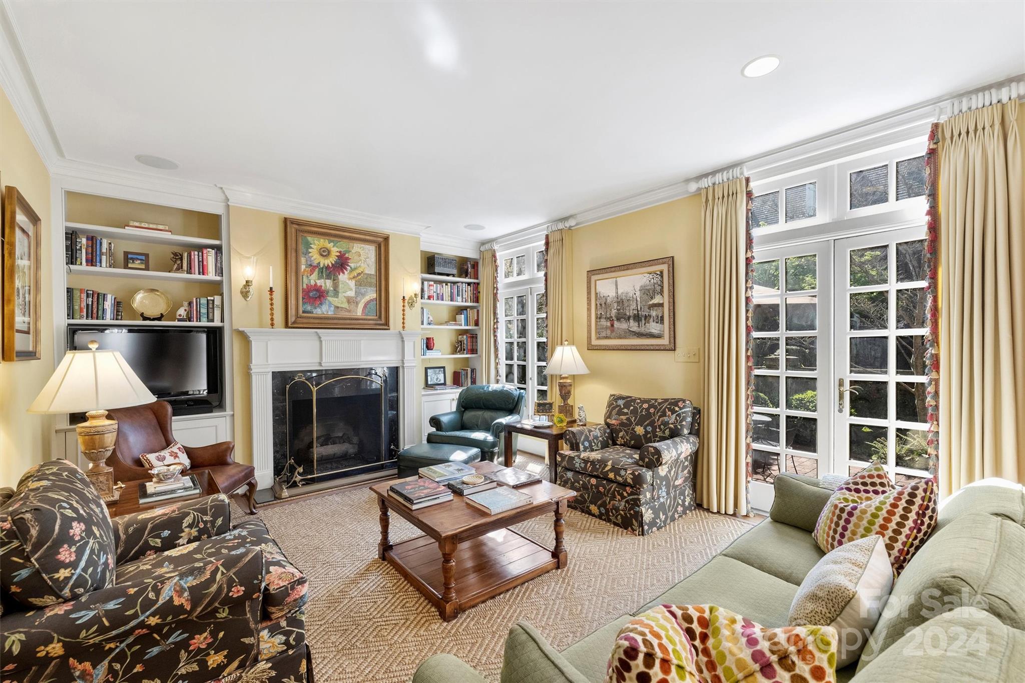 1905 Queens Road Charlotte, NC 28207 - Photo 9 of 44 a living room with furniture large window and a fireplace