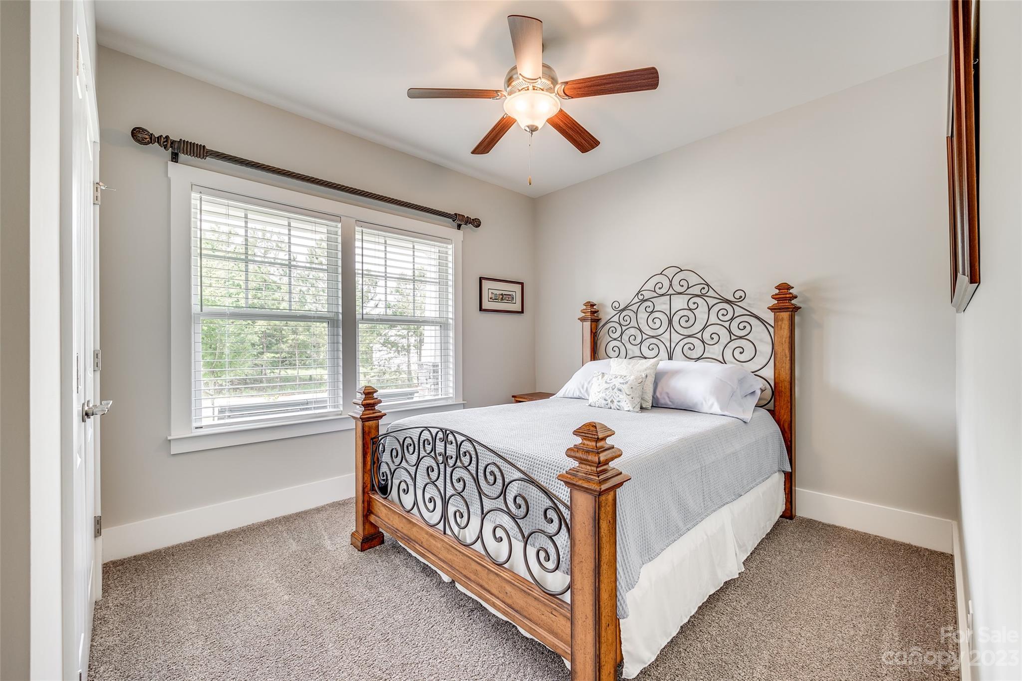 5284 Admirals Landing Lancaster, SC 29720 - Photo 25 of 48 a bedroom with a bed chandelier and a window