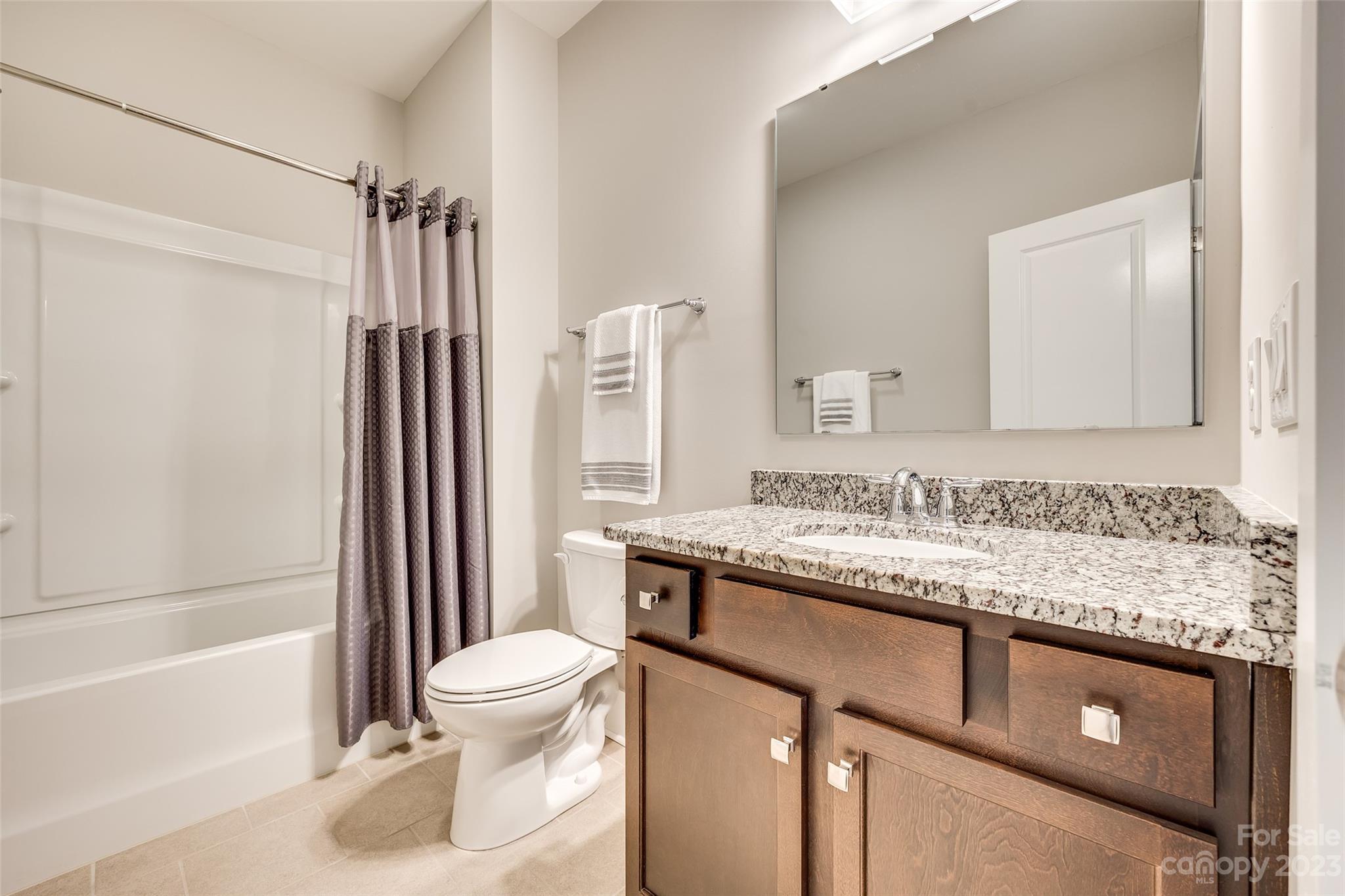 5284 Admirals Landing Lancaster, SC 29720 - Photo 27 of 48 a bathroom with a granite countertop sink toilet and shower