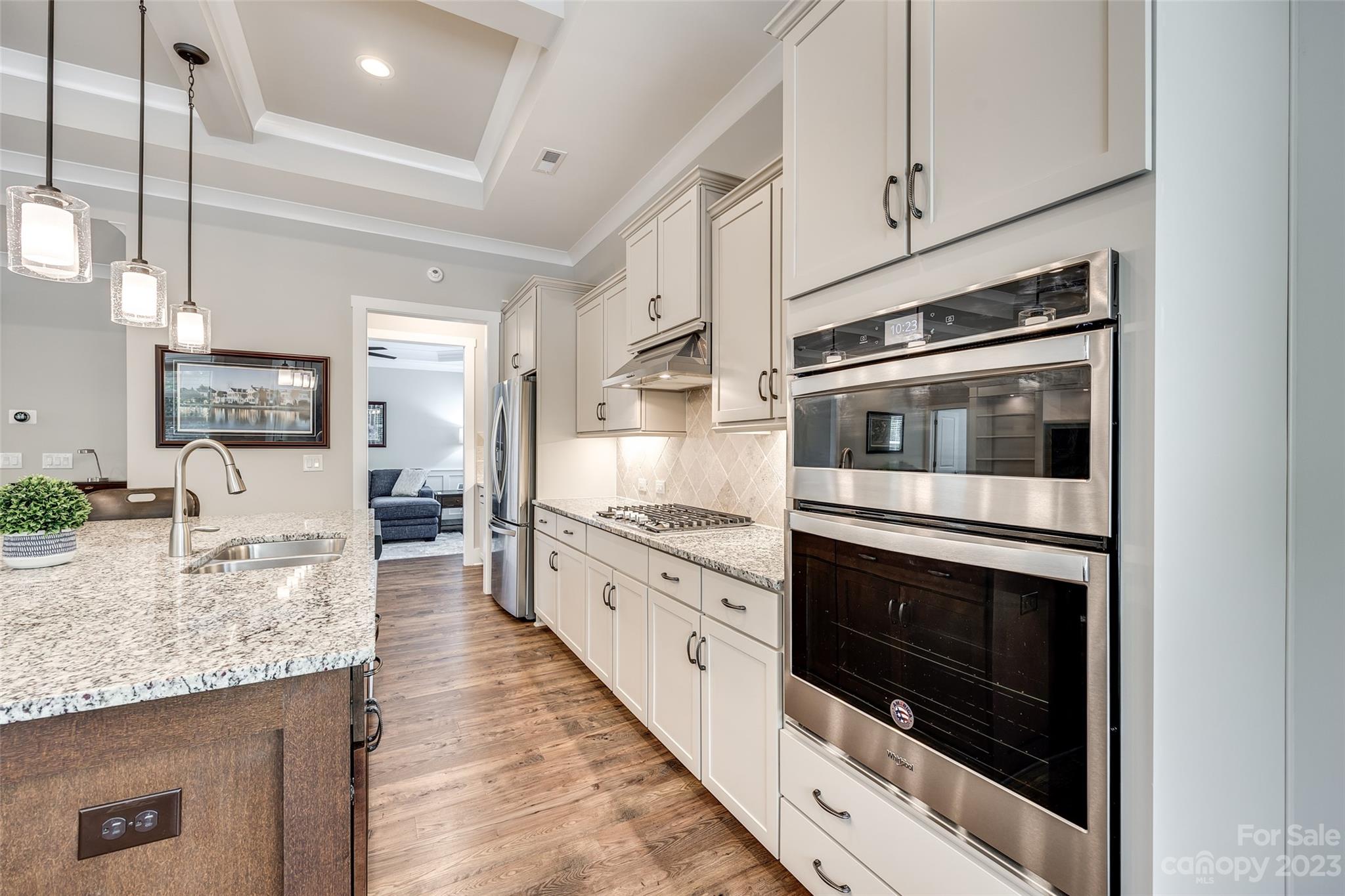 5284 Admirals Landing Lancaster, SC 29720 - Photo 10 of 48 a kitchen with stainless steel appliances granite countertop a stove microwave and cabinets
