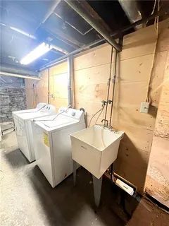 a kitchen with a refrigerator stove and a sink