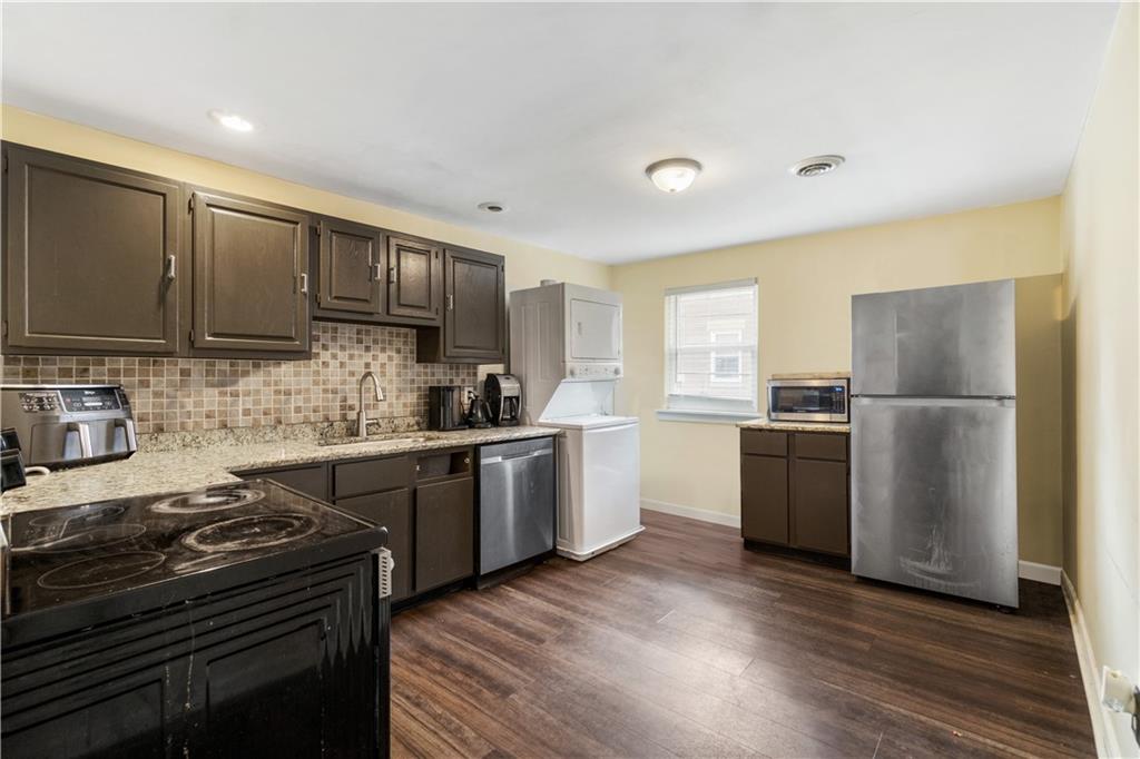 3435 Denny Street Pittsburgh, PA 15201 - Photo 20 of 29 a kitchen with a refrigerator stove and a sink