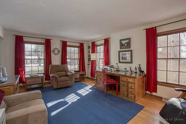 1016 Stoddard Avenue Wheaton, IL 60187 - Photo 2 of 14 a living room with furniture and a flat screen tv